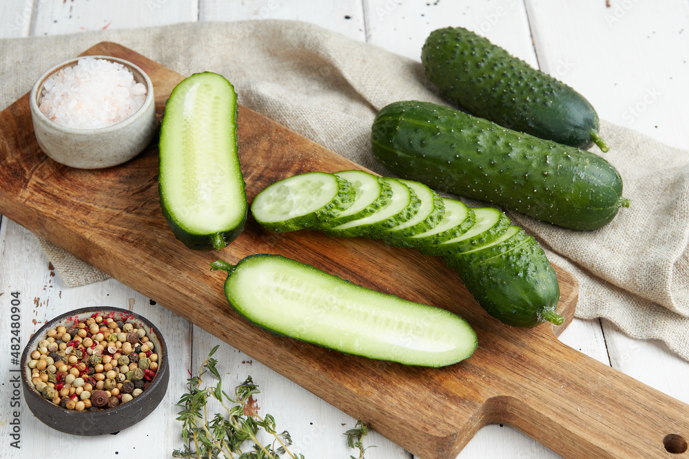 Fresh cucumber on white wood table Fresh cucumber on white wood table