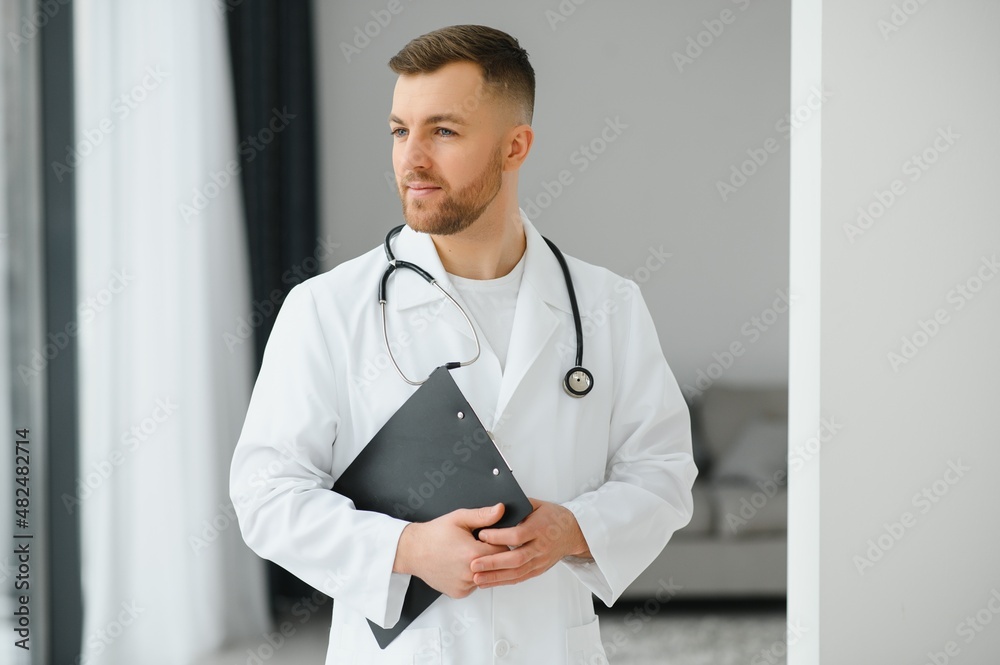 handsome male doctor portrait in office handsome male doctor portrait in office