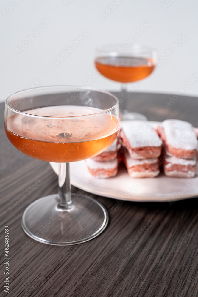 Symbols of Reims - glasses of rose brut champagne and rose biscuits Symbols of Reims - glasses of rose brut champagne and rose biscuits