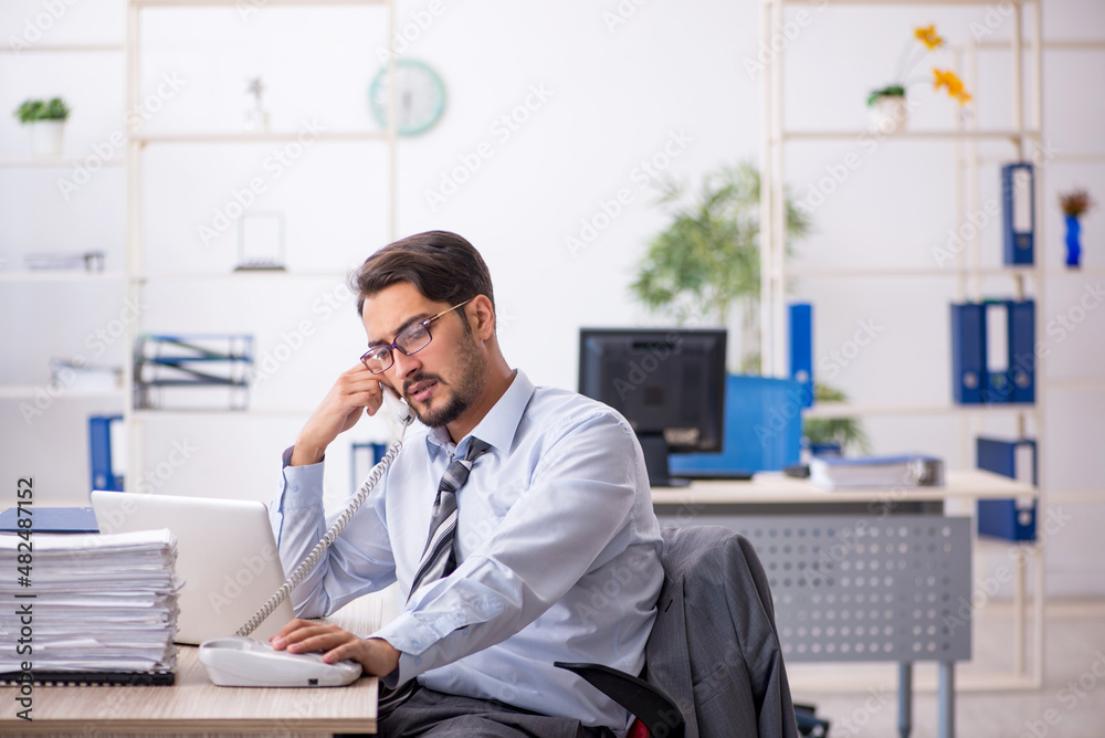 Young businessman employee working in the office Young businessman employee working in the office