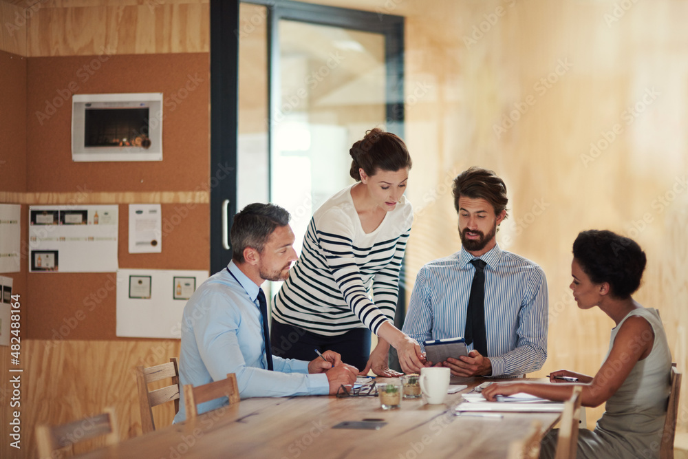Putting their desing into action. Shot of a group of colleagues working together in an office. Putting their desing into action. Shot of a group of colleagues working together in an office.