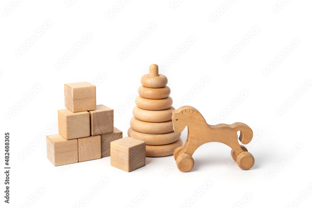 wooden toys on a white background, cubes, pyramid, horse