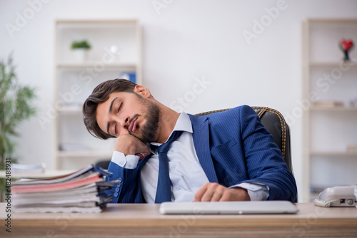 Young male employee extremely tired in the office © Elnur