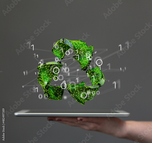 hand holding green recycle ...