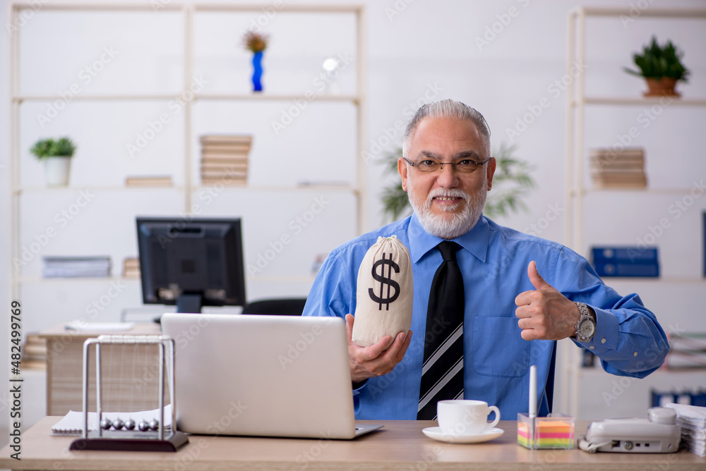 Old male employee in remuneration concept Old male employee in remuneration concept