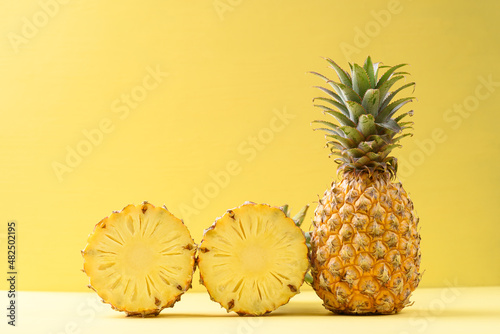 Fresh pineapple fruit on yellow background, Tropical fruit