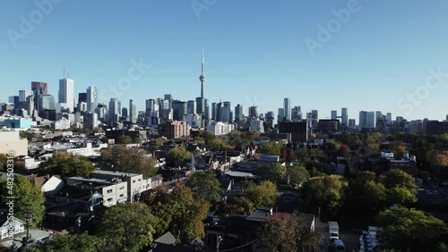 Flying over Kensington Market showing off the Toronto city skyline on a clear fall evening. photo