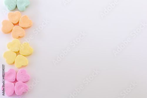 Conversation hearts on white background flat lay.