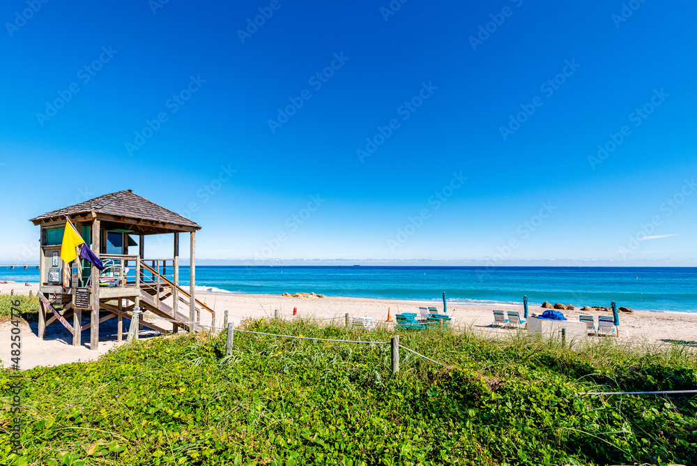 Lifeguard station with beach and ocean in Deerfield Beach, Florida. Clear Blue sky with empty space Lifeguard station with beach and ocean in Deerfield Beach, Florida. Clear Blue sky with empty space