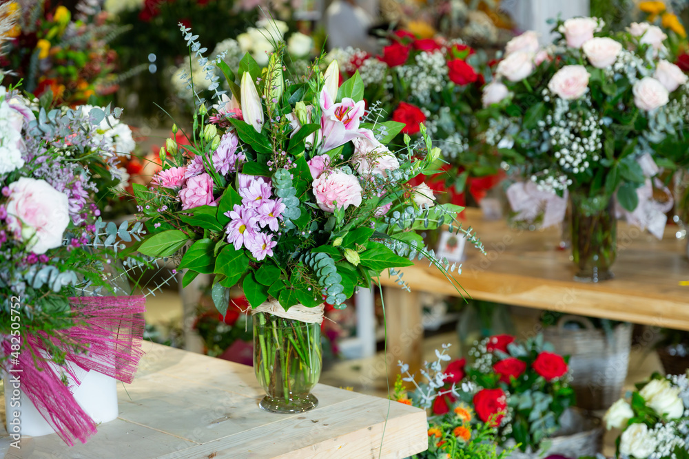 Bouquet of flowers on background of other flowers in vase in a flower shop
