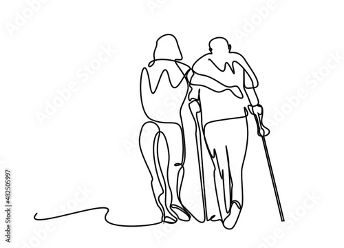 young person helping elderly person with walking disability
