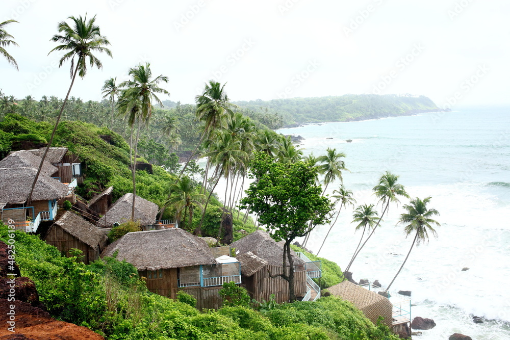 Thatched roofed hotels along the beach at Cabo De Rama in South Goa ...