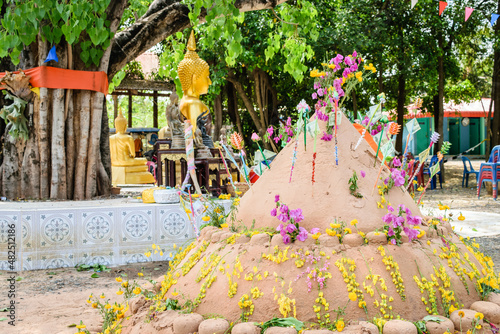 pagoda and flower on sand in Songkran day festival , Thailand.