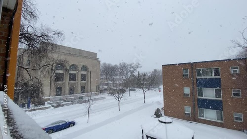 Winter storm snow falling on a residential area in Minneapolis Minnesota photo