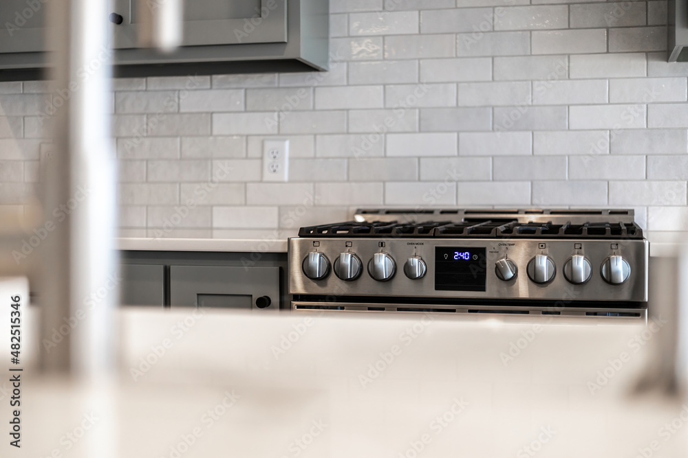 Fototapeta premium High end stainless steel gas stove in a modern luxury kitchen