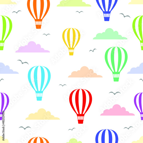 Colorful hot air balloons in colorful cloudy sky seamless pattern. Flying birds silhouette. Repeatable wallpaper.