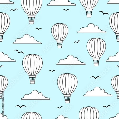 Black and white outline ho air balloons pattern in cloudy sky with flying birds. Repeatable wallpaper.