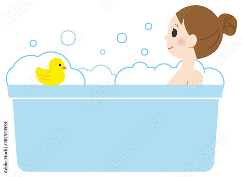 A woman taking a bath and relaxing.