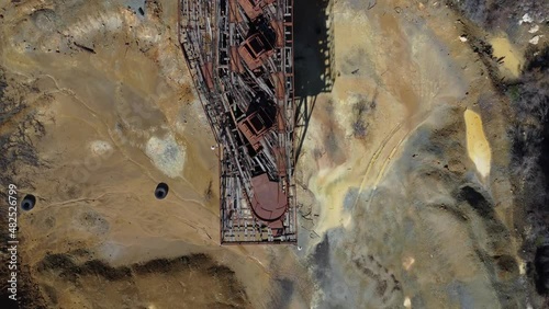 Bird's eye view of the rusted trolley track on top of the deserted Mitsero copper mines. photo