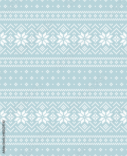 Christmas pattern in blue and white with fair isle ornament. Seamless pixel nordic vector with snowflakes for New Year gift paper, jumper, socks, mittens, other winter holiday textile or paper print.