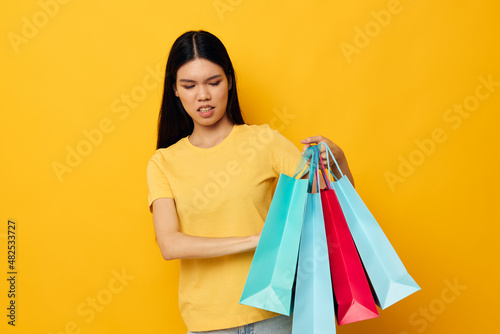 Portrait Asian beautiful young woman fashion shopping posing isolated background unaltered