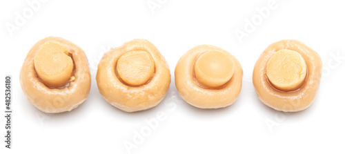 Pickled champignons isolated on a white background.