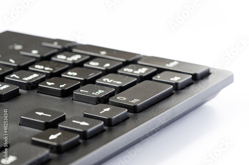 Computer keyboard on a white background. Copy space