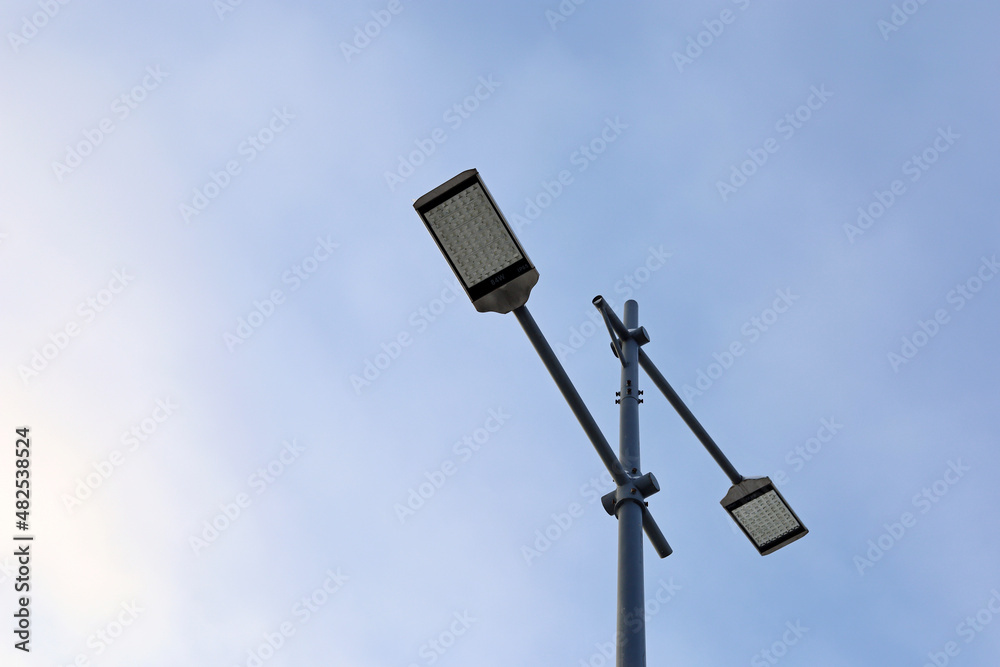 LED street lamps on background of blue sky. Led lights saving electrical energy LED street lamps on background of blue sky. Led lights saving electrical energy