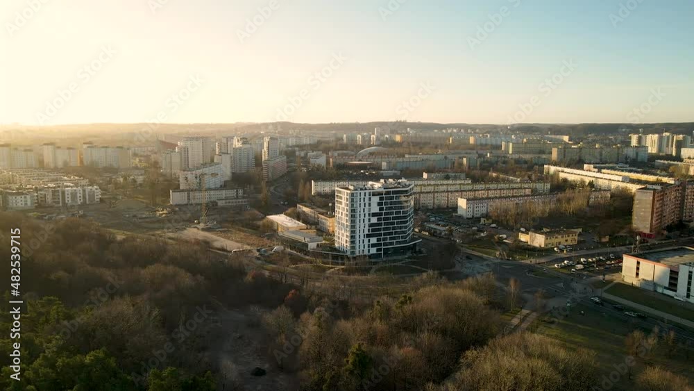 Eastern Europe city with a green park, buildings and cars that cross the street Eastern Europe city with a green park, buildings and cars that cross the street