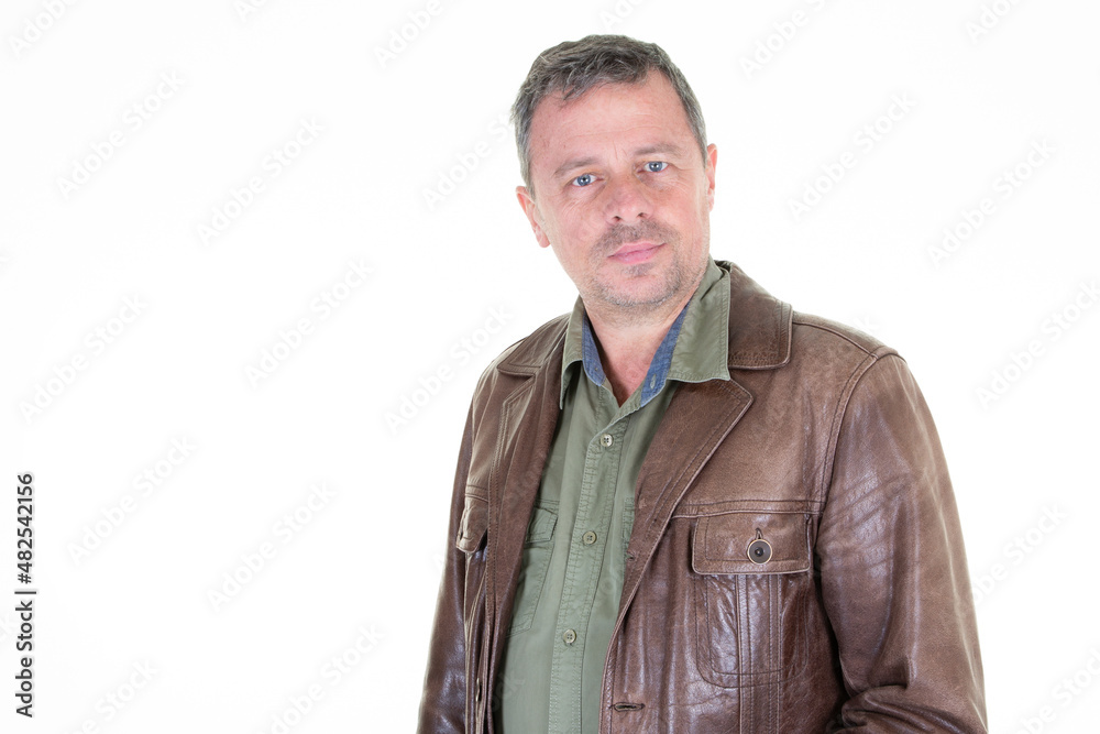 Handsome middle age man leather jacket portrait looking at camera on white background Handsome middle age man leather jacket portrait looking at camera on white background