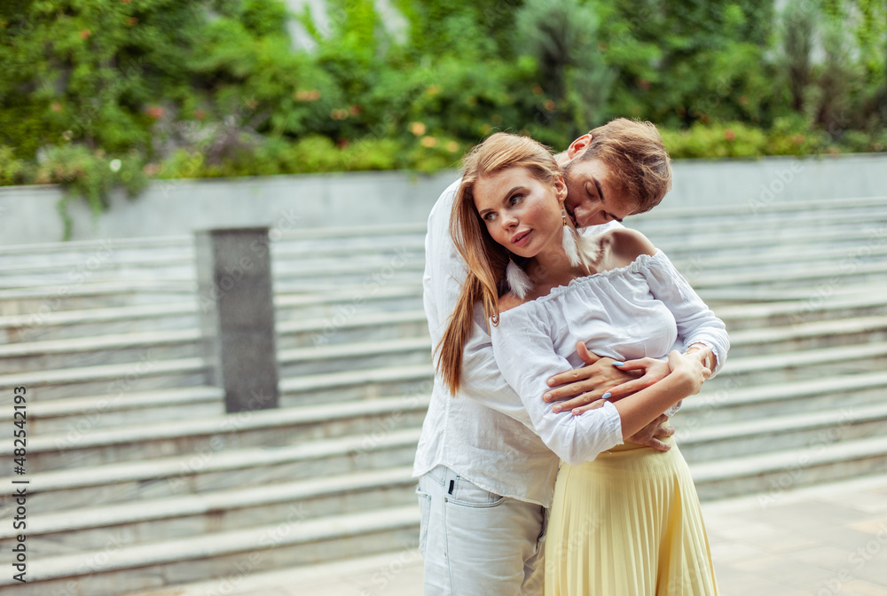 Romantic portrait of a couple in love spending time together in a city park Romantic portrait of a couple in love spending time together in a city park