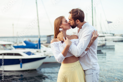 Kissing couple in love in the yacht club. Romantic, love concept