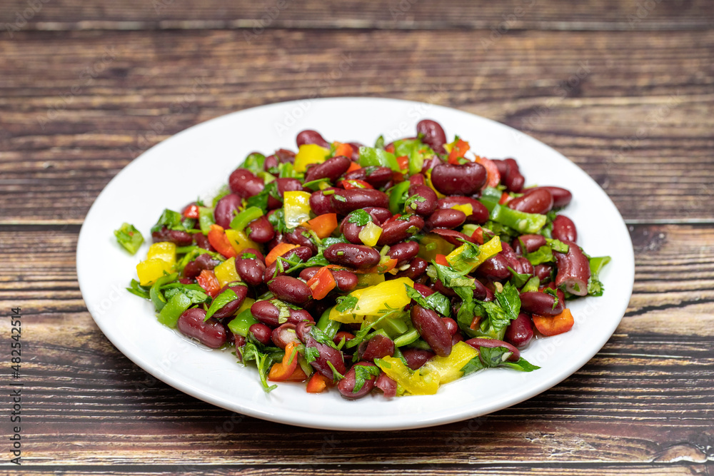 Mexican Bean Salad. Homemade black bean served in a ceramic plate, selective focus Mexican Bean Salad. Homemade black bean served in a ceramic plate, selective focus