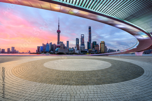 Print op canvas Panoramic skyline and modern commercial buildings with empty square floor in Shanghai at sunrise, China