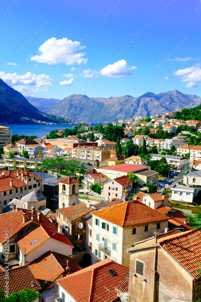 Kotor Montenegro. Boko Kotor Bay panoramic view. Beautiful summer day with blue sky and clouds.