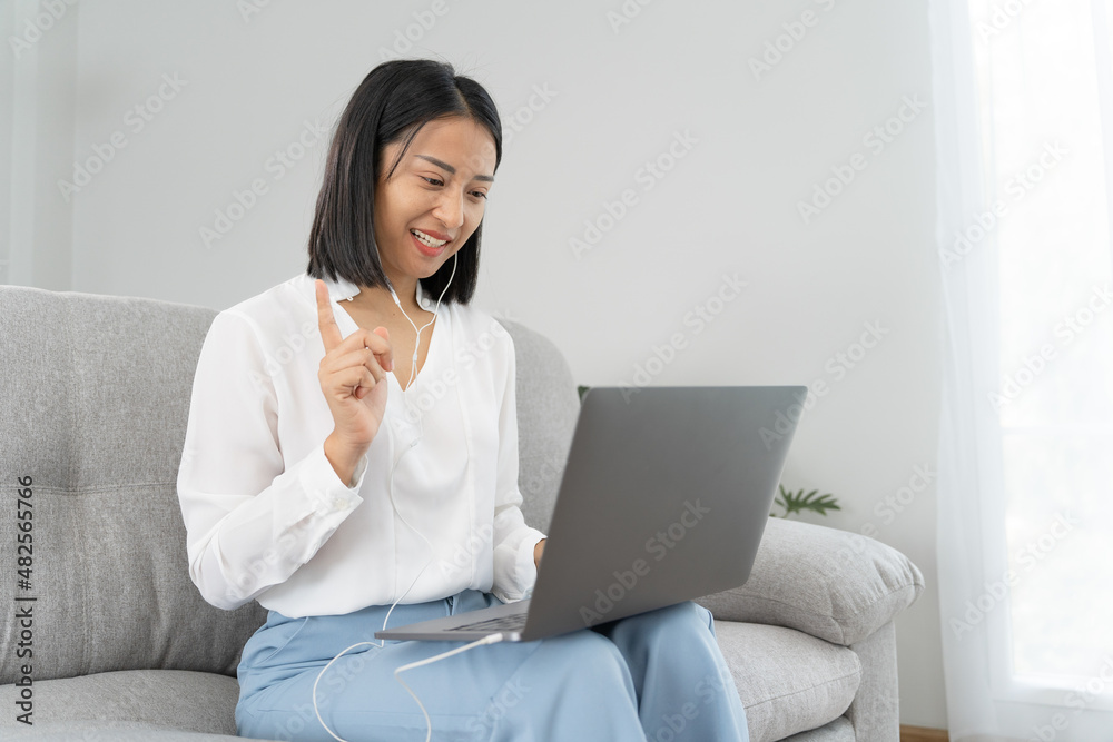Asian woman use headphones for video conferencing with business team or customer. Business woman present and talk by online internet communication at home. Applicants interviewed for jobs online. Asian woman use headphones for video conferencing with business team or customer. Business woman present and talk by online internet communication at home. Applicants interviewed for jobs online.