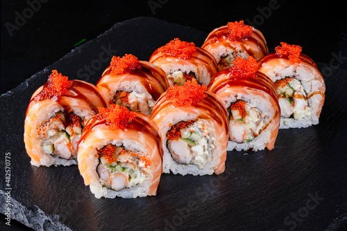 Set fresh delicious Japanese sushi on dark background