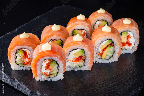 Set fresh delicious Japanese sushi on dark background