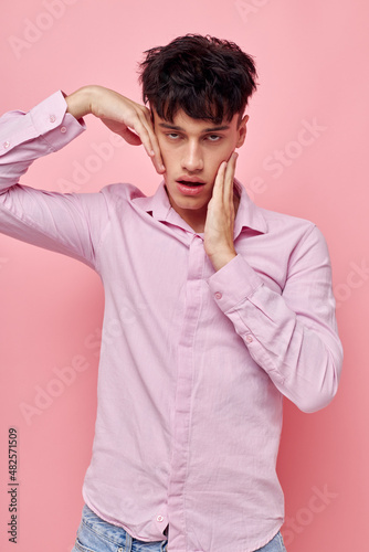 Photo of romantic young boyfriend gestures with hands emotions hairstyle fashion Lifestyle unaltered