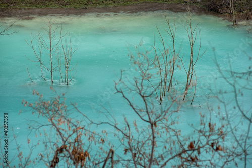 Fototapeta Naklejka Na Ścianę i Meble -  Turquoise waste waters from a copper mine polluting  the environment. Geamana decantation lake, Romania