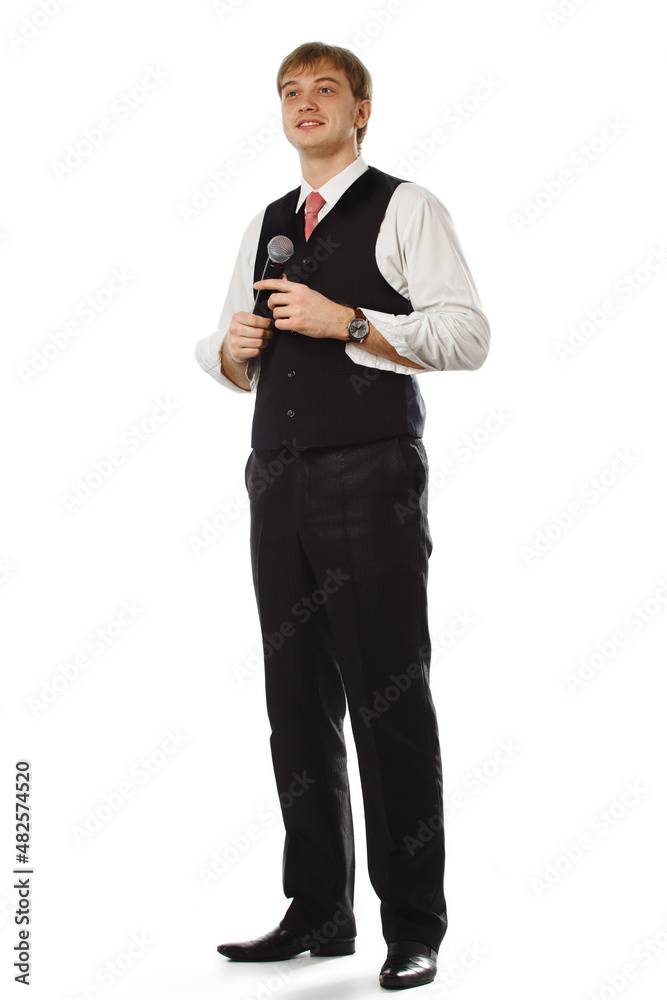 Young handsome guy with microphone in hands Young handsome guy with microphone in hands