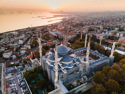 Aerial view of Blue Mosque with six minarets in Istanbul, Turkey. Top view of tourist famous place Sultanahmet Camii in the old city center on sunset