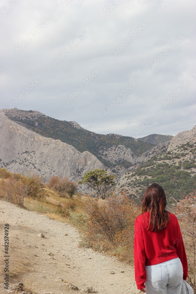 Woman looking at the mountains