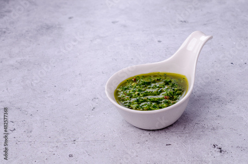 Green sauce in ceramic dishes