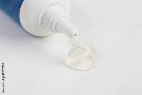 Close up image of cosmetic tube with squezzed gel