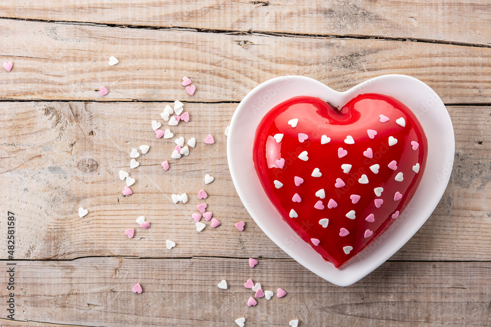 Heart shaped cake for Valentine's Day or mother's day on wooden table. Copy space Heart shaped cake for Valentine's Day or mother's day on wooden table. Copy space