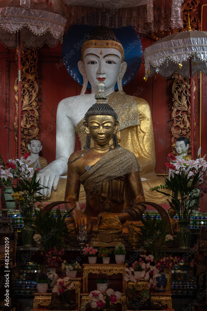 Beautiful Shan style Buddha subduing Mara statues in vihara at ancient Wat Pa Pao buddhist temple, Chiang Mai, Thailand