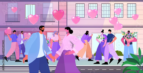 loving people celebrating happy valentines day men women in love walking outdoor on city street cityscape