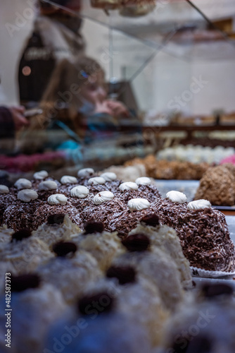 Ready-made cakes in the pastry shop window. The cakes Le Merveilleux , L'Impensable and L'Incroyable. Famous, divinely delicious, delicate delicacies of Franco-Belgian origin.