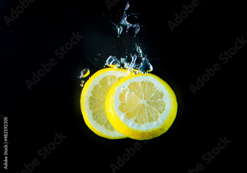 Lemon Slice in Water on Black Background, Lemon in Water on Black Background, © Max Chekanov
